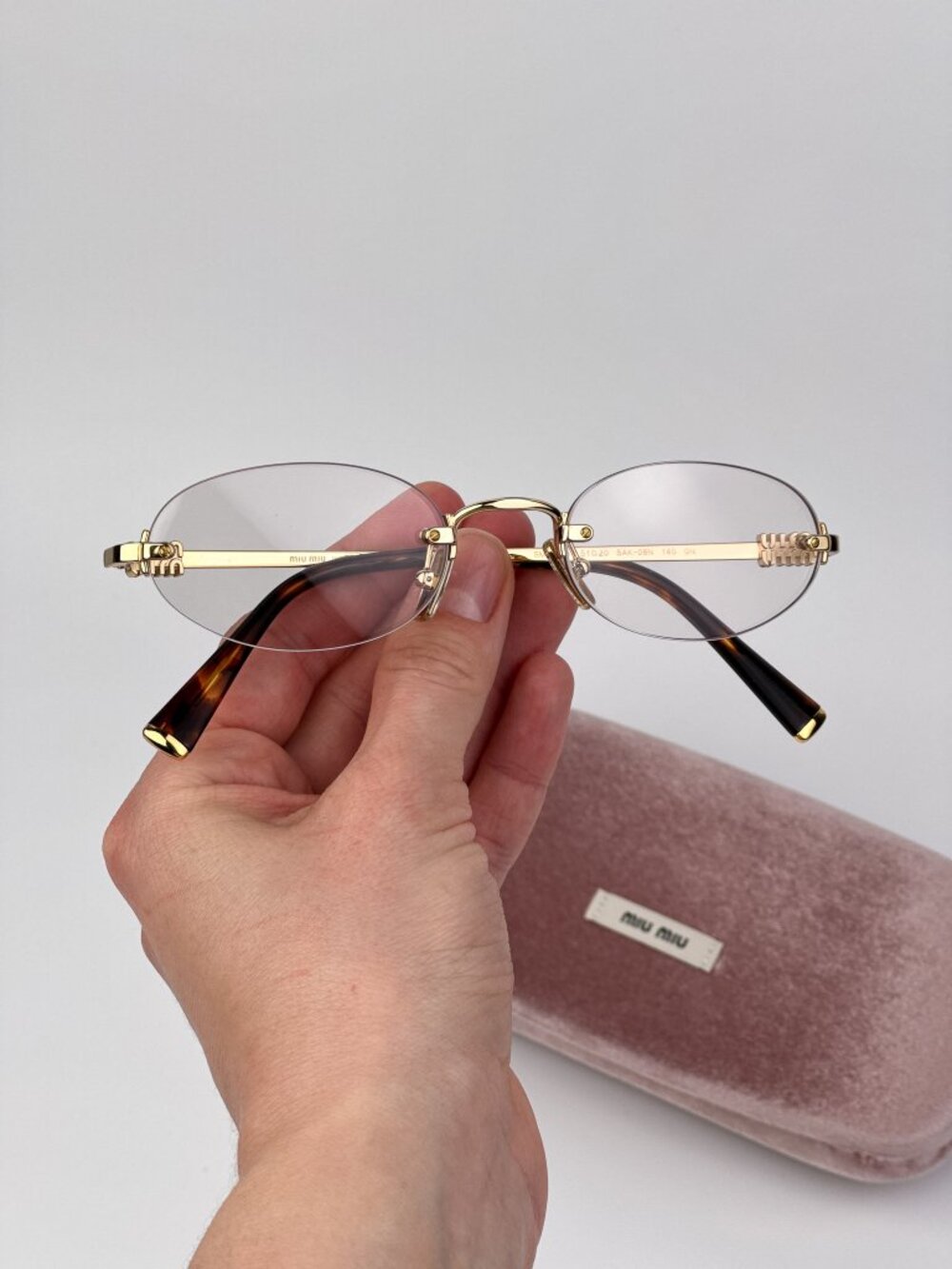 Miu Miu Women’s Eyeglasses – MUA54S 5AK08N | Gold Oval Rimless